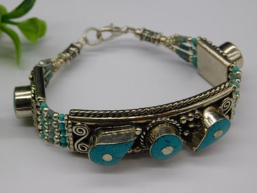 Turquoise and Silver-Toned Bracelet with Intricate Details