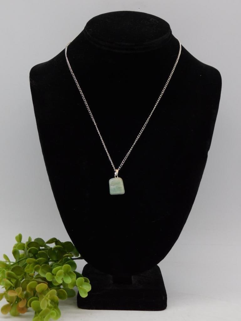 Necklace with Rectangular Amazonite Pendant ROCK STONE LAPIDARY SPECIMEN: Chain with a simple design. | Features a rectangular green stone pendant with subtle variations in hue. | Comes displayed on a black jewelry stand for presentation. | Measuring ruler included for scal