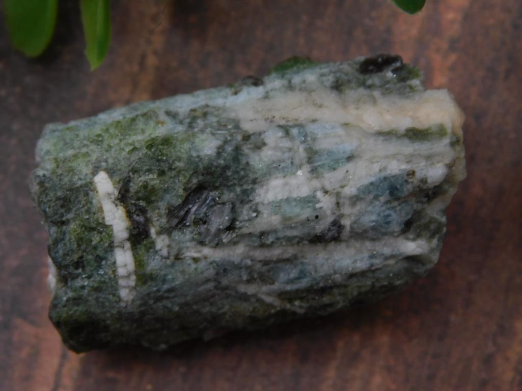 Green Tourmaline Mineral Specimen from Mozambique Rock Stone Lapidary Specimen: Green Tourmaline mineral specimen sourced from Mozambique. | Comes in a labeled display box for presentation and protection. | Weight labeled as 29 grams, suitable for collectors or enthusiasts. | Inc
