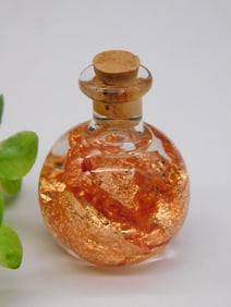 Glass Bottle With Gold-Colored Foil Accents