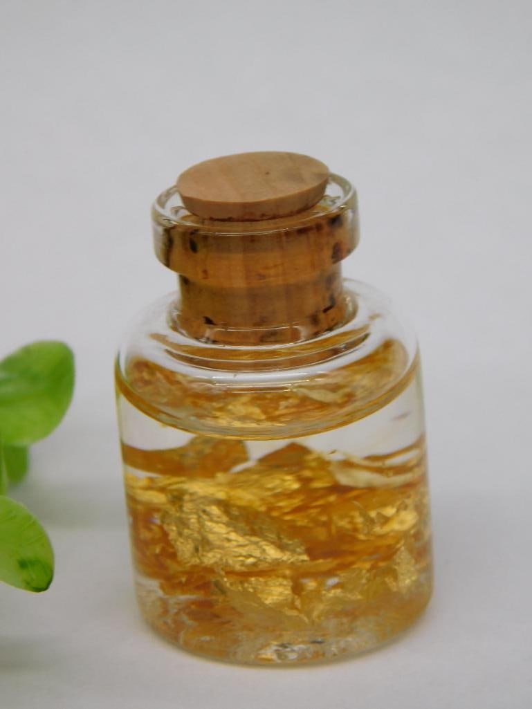 Gold Flakes in Bottle Rock Stone Lapidary Specimen: Gold Flakes in Bottle Rock Stone Lapidary Specimen