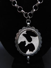 COW HIDE PENDANT ON CHAIN NECKLACE