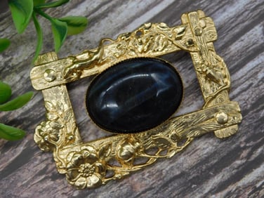 Gold-Tone Brooch with Black Stone Centerpiece