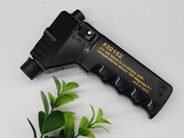 Black Plastic Handheld Tool with Grip and Attachment