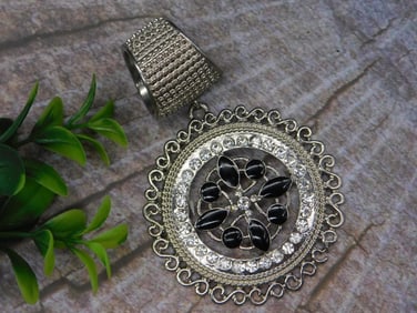 Elegant Silver-Tone Pendant with Black and Clear Accents