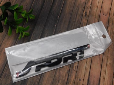 Black Sport Logo Emblem in Original Packaging