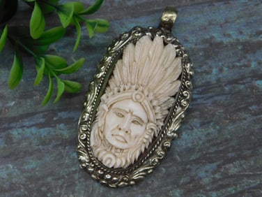 Engraved Pendant with Carved Chief Decoration and Intricate Tooling