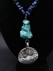 HAMMERED DISC AND TURQUOISE PENDANT ON LAPIS LAZULI CHIP NECKLACE