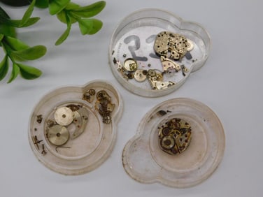 Three Watch Movement Parts in Plastic Cases WATCHMAKER WATCHMAKING TOOLS