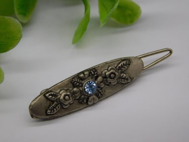 Vintage Silver-Tone Floral Brooch with Blue Stone Accent