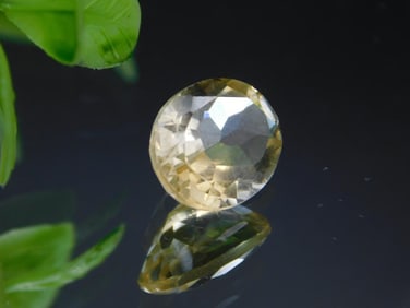 Oval-Faceted Yellow Gemstone with Translucent Hue ROCK STONE LAPIDARY SPECIMEN