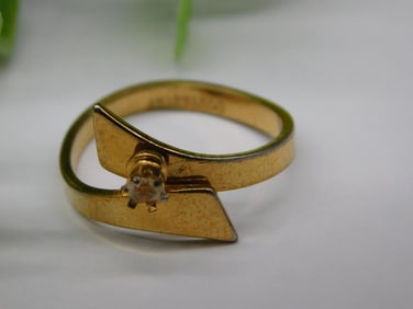 Gold Ring with Diamond Accent and Unique Design