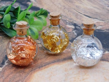 GOLD SILVER AND COPPER FLAKES IN BOTTLES