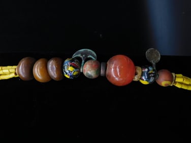 Necklace With Beads, Yellow Strands, and Horn Pendant