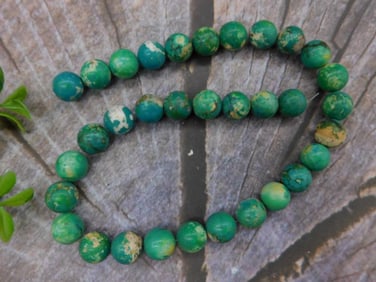 Strand of Round Green Beads with Mixed Patterns Rock Stone Lapidary Specimen