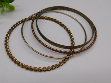 Four Gold-Tone Bangles in Assorted Styles