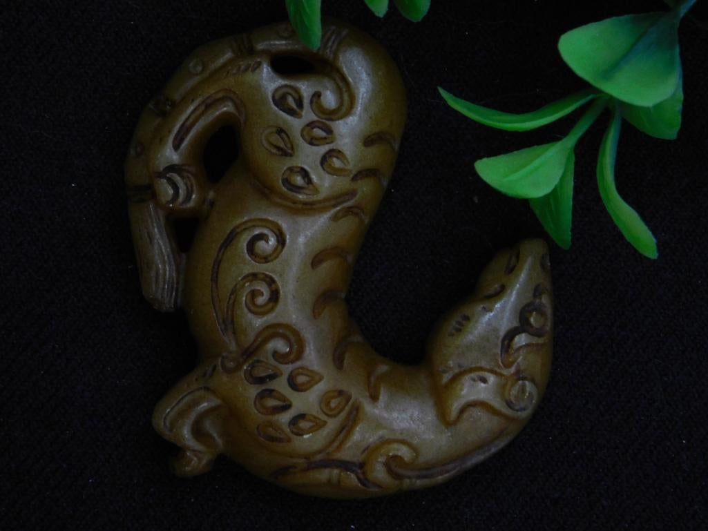 Carved Jade Pendant With Animal Motif: Carved Jade Pendant With Animal Motif