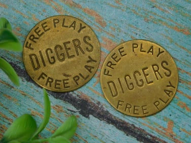 Pair of ?iggers Free Play' Brass Tokens