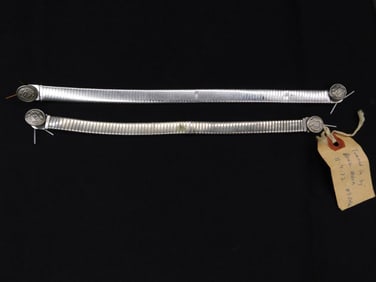 Two Silver Metal Bands with Decorative Ends