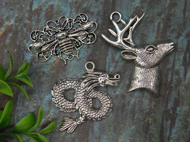 Set of Three Metal Animal Pendants Including Bee, Deer, and Dragon