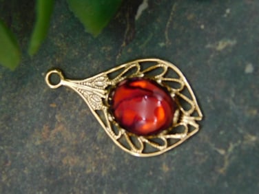 Gold-Tone Pendant With Red Stone