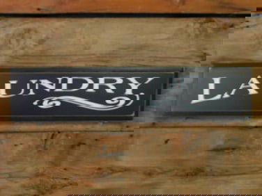 Vintage Wooden Laundry Sign With Decorative Detail