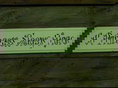 Wooden Sign With A Princess Sleeps Here Text
