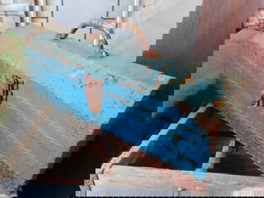 VINTAGE BLUE METAL TOOLBOX WITH CURVED COFFIN TOP DESIGN