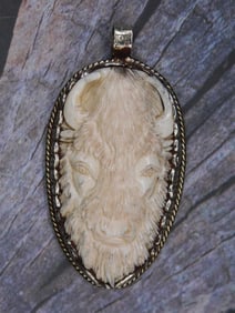 CARVED BISON PENDANT WITH INTRICATE TOOLING