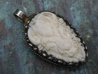 CARVED BISON PENDANT WITH INTRICATE TOOLING