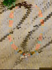 SHELL PENDANT ON AFRICAN TRADE BEAD NECKLACE WITH METAL ACCENTS