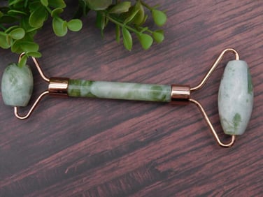 Green Jade Roller Facial Tool with Rose-Gold Accents