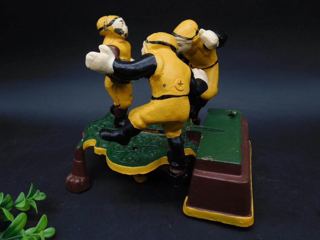 Cast Iron Football Player Mechanical Bank: Cast Iron Football Player Mechanical Bank