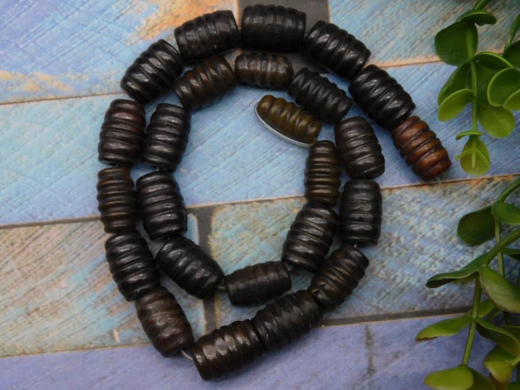 Strand of Dark Brown Barrel-Shaped Beads: Strand of Dark Brown Barrel-Shaped Beads