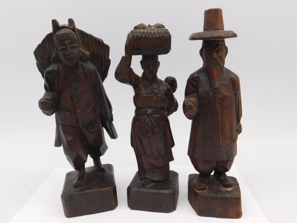 Three Hand-Carved Wood Figurines in Traditional Attire (1 of 3)