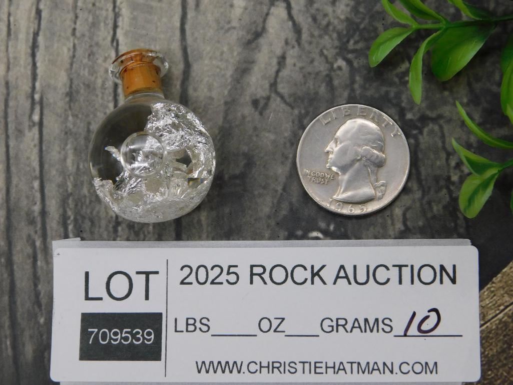 Small Glass Bottle with Silver-Colored Foil Inside: Small Glass Bottle with Silver-Colored Foil Inside