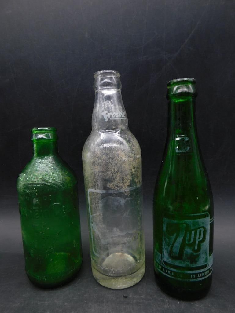Vintage 7-Up, Frostie, and Green Glass Bottles Trio: Vintage 7-Up, Frostie, and Green Glass Bottles Trio