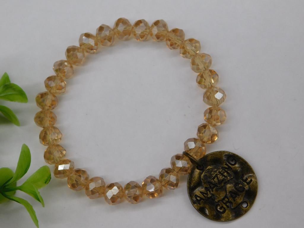 Faceted Bead Stretch Bracelet with Metal Charm: Faceted Bead Stretch Bracelet with Metal Charm