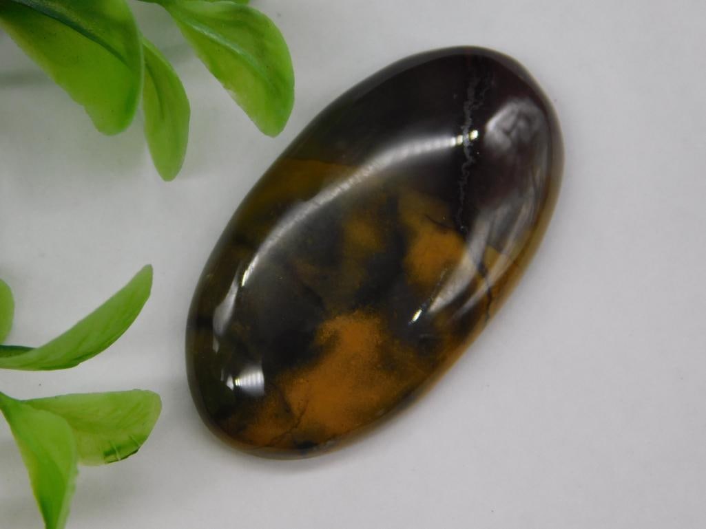 Oval Cabochon with Amber and Dark Hues: Oval Cabochon with Amber and Dark Hues