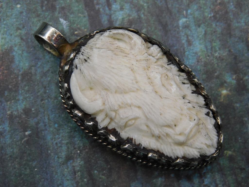 CARVED BISON PENDANT WITH INTRICATE TOOLING: CARVED BISON PENDANT WITH INTRICATE TOOLING
