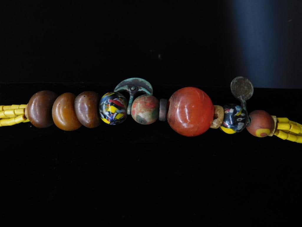 Necklace With Beads, Yellow Strands, and Horn Pendant: Necklace With Beads, Yellow Strands, and Horn Pendant