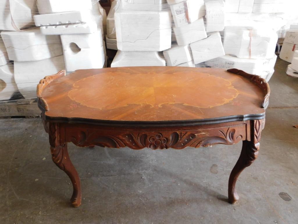 FRENCH-STYLE COFFEE TABLE WITH CARVED DETAILS ON LEGS AND FRAME: PICK UP APRIL 2ND FROM 12-2 IN THAYER, MO OR BY APPOINTMENT ON A PRE-SCHEDULED DAY THAT MAY INCUR A FEE.