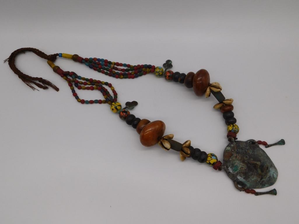 AFRICAN TRADE BEAD ORNATE CEREMONIAL NECKLACE WITH METAL MASK ACCENT: AFRICAN TRADE BEAD ORNATE CEREMONIAL NECKLACE WITH METAL MASK ACCENT