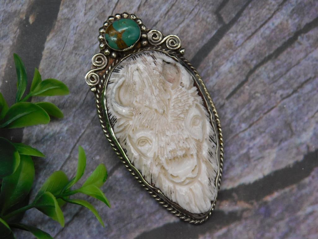 CARVED BISON PENDANT WITH TURQUOISE ACCENT: CARVED BISON PENDANT WITH TURQUOISE ACCENT
