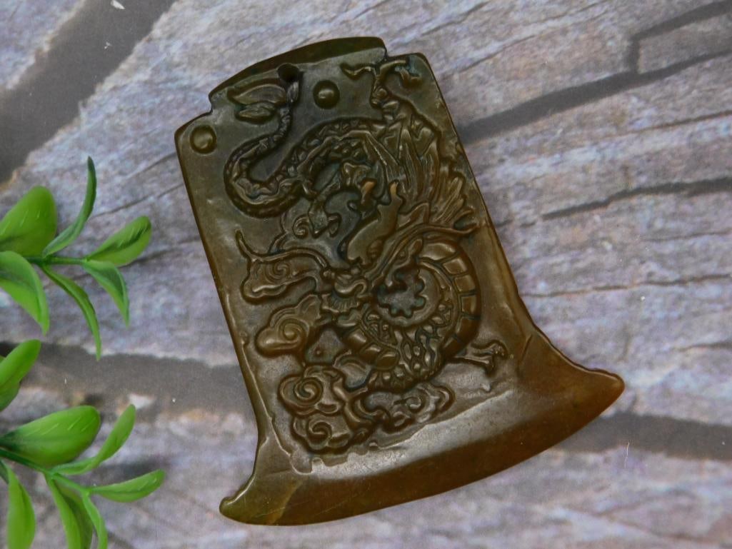 Carved Jade Axe-Shaped Pendant with Dragon Motif: Carved Jade Axe-Shaped Pendant with Dragon Motif