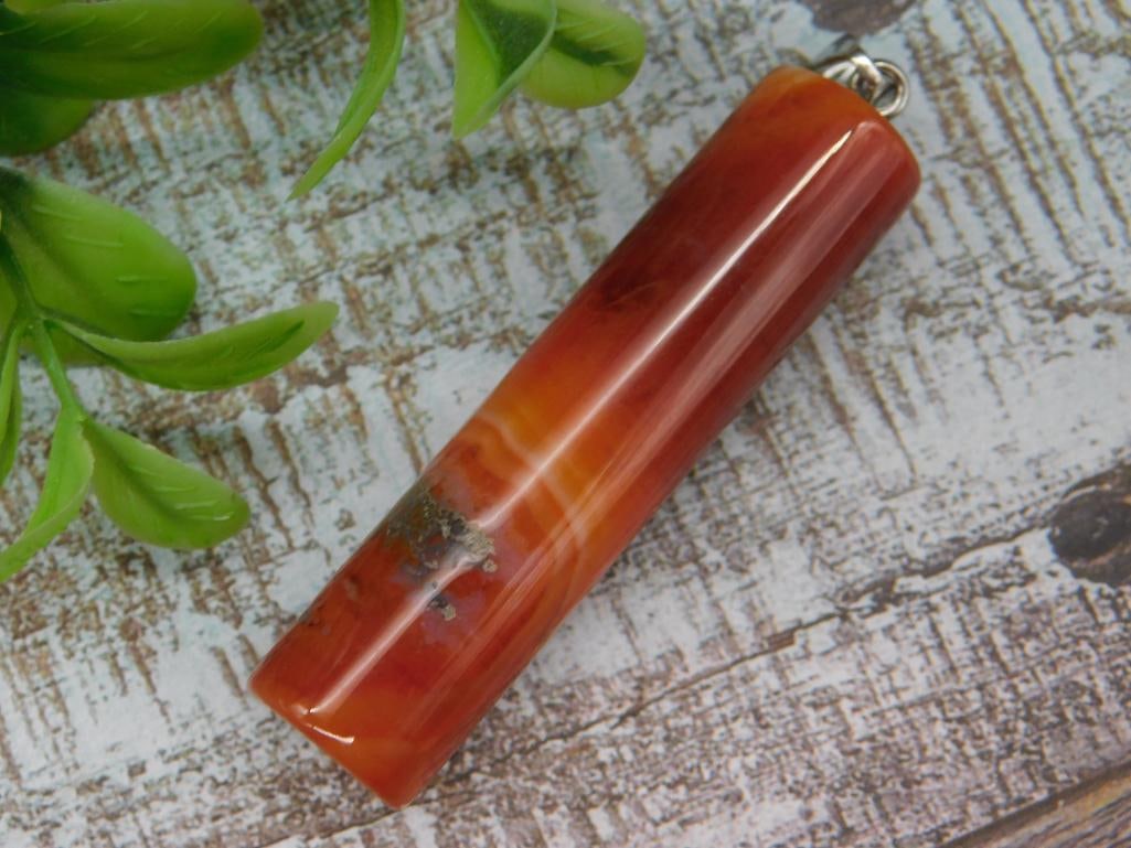 Polished Red-Orange Stone Pendant With Inclusions: Polished Red-Orange Stone Pendant With Inclusions