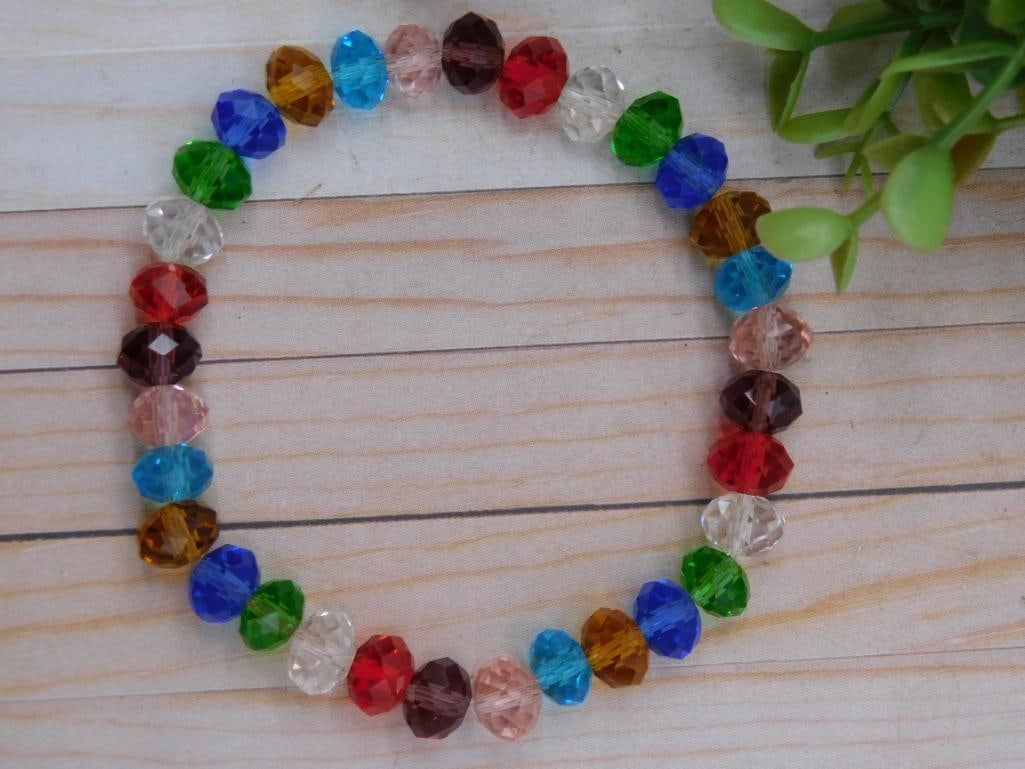 Multicolored Faceted Bead Stretch Bracelet: Multicolored Faceted Bead Stretch Bracelet ? Authentic estate find offered in our online auction. Perfect for collectors, resellers, and enthusiasts of vintage, antiques, minerals, rocks, crystals,