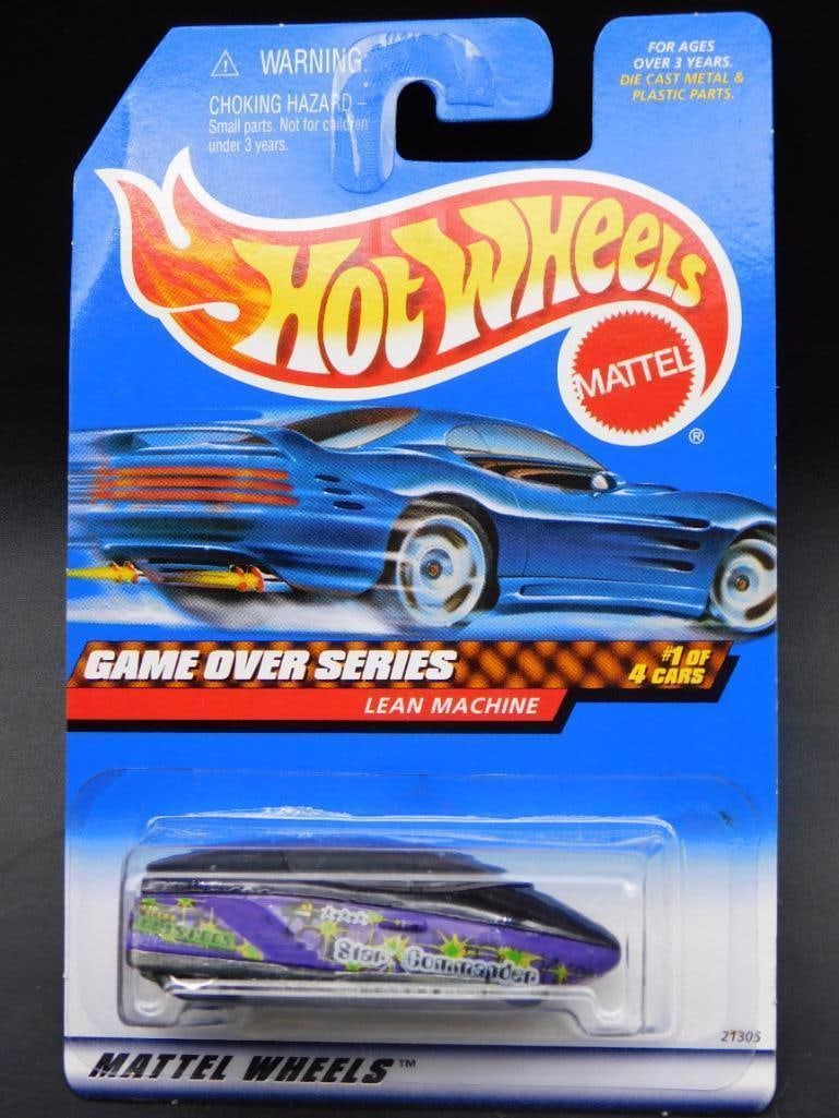 Hot Wheels Game Over Series Lean Machine #967: Hot Wheels Game Over Series Lean Machine #967. Features a blue card with bold graphics and a purple and green car visible in blister packaging. Includes collector number 967, Mattel branding, and deta