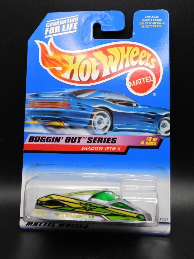Hot Wheels Shadow Jet II From Buggin Out Series: Hot Wheels die-cast car, Shadow Jet II model, from the Buggin' Out Series. Collector number 942. Still in original packaging, unopened and sealed. Packaging shows minor signs of handling. Features