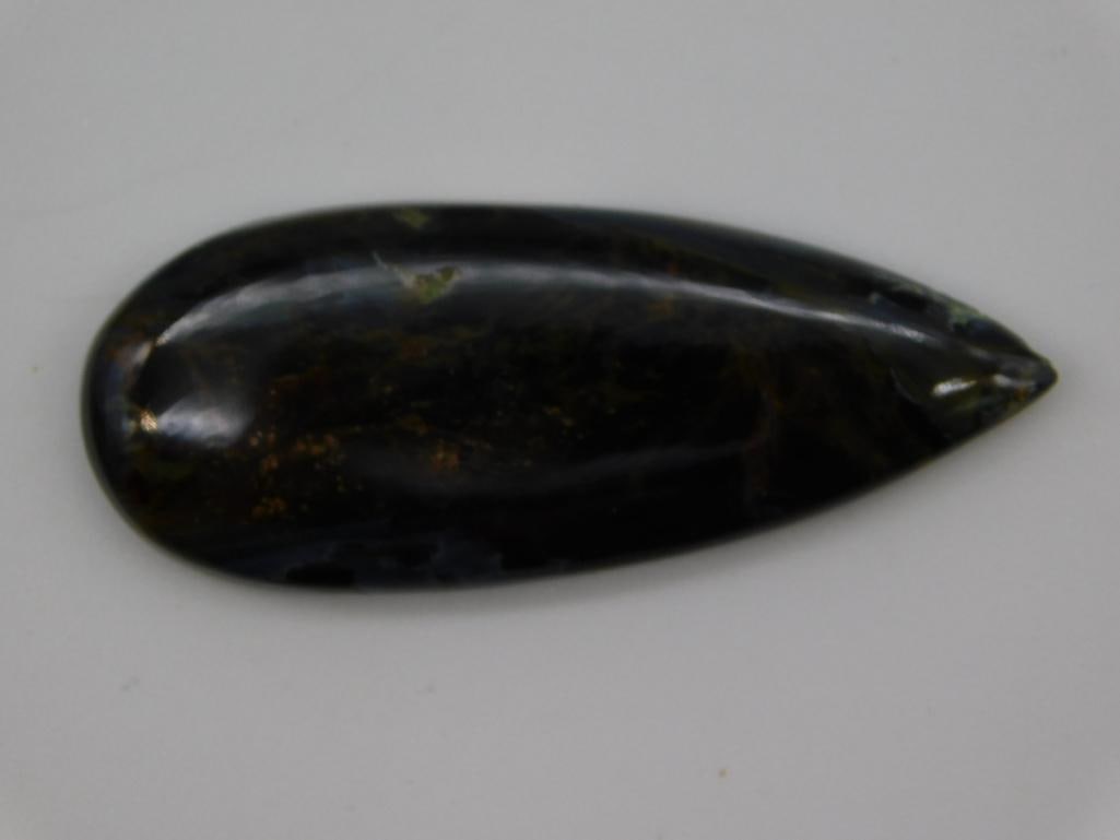 PIETERSITE CABOCHON ROCK STONE LAPIDARY SPECIMEN: WELCOME TO HATMAN AUCTIONS! SPECIAL NOTICE: Please see photos for measurements and descriptions. ***Yes, we have in house shipping with MANY REPEAT CUSTOMERS because of our streamlined service.